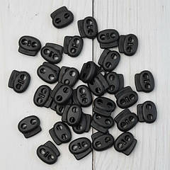 Фіксатор для шнура пластиковий, чорний.