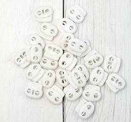 Фіксатор для шнура пластиковий, білий.