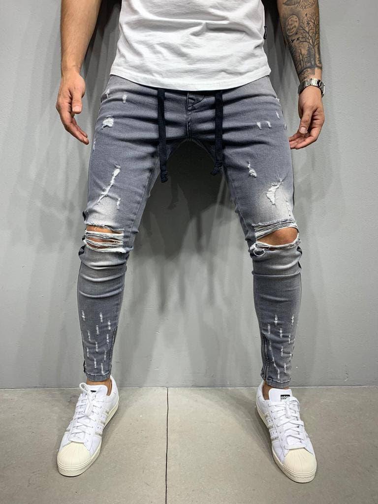 Чоловічі якісні джинси слім із потертостями та дірками сірі. Чоловічі звужені джинси