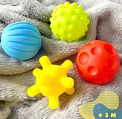 Набір тактильних сенсорних м'ячиків 0987 4 м'ячика масажні кульки для немовляти розвиваючі Монтессорі