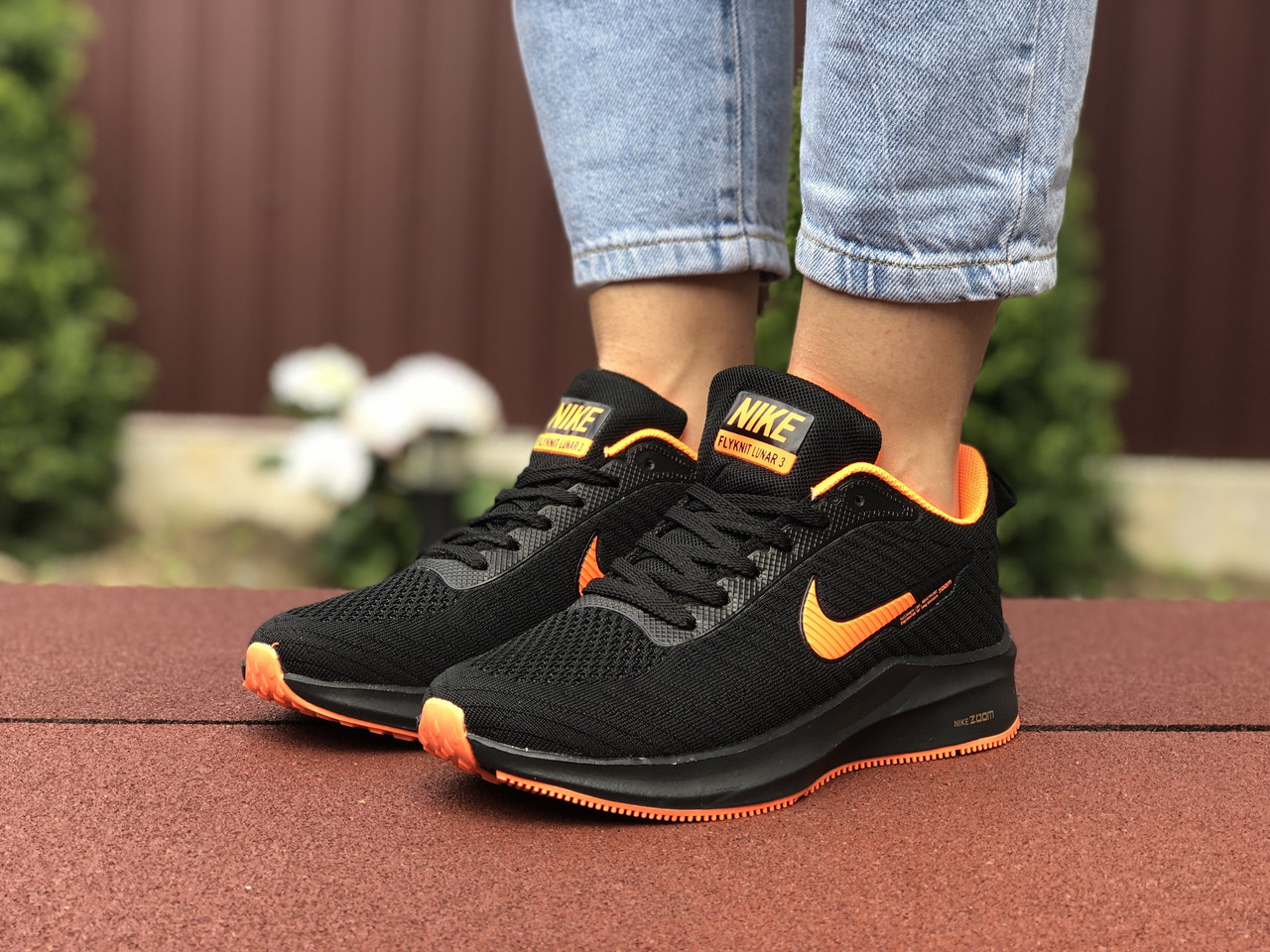 Жіночі кросівки Nike Flyknit Lunar 3 чорні з помаранчевим