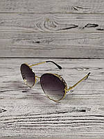 Солнцезащитные очки женские круглые в металлической оправе