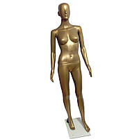 Безликий жіночий манекен золотого кольору
