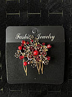 Гребінець золотистий для волосся з червоними намистинами з червоними кристалами квіточок розмір 6х5 см