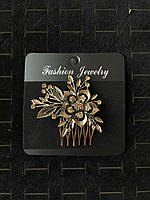 Гребінець золотистий для волосся з золотистими кристалами квіточок із пелюстками розмір 7х6 см