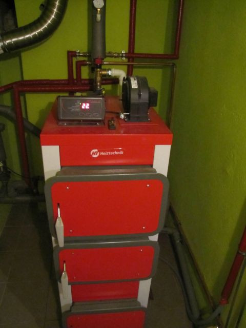 Универсальный котел отопления на твердом топливе длительного горения Heiztechnik Q HIT Plus 30 - фото 4 - id-p253386460