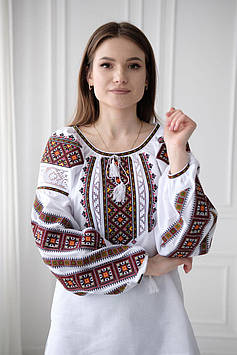 Українська вишиванка жіноча біла з великим різнокольоровим етно орнаментом, тканина - домоткане полотно
