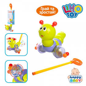 Каталка 686 гусениця розміром 21-22см, на палиці 52см, музика (3 мелодії), світло, ворушить головою, на листі, 52-21см.