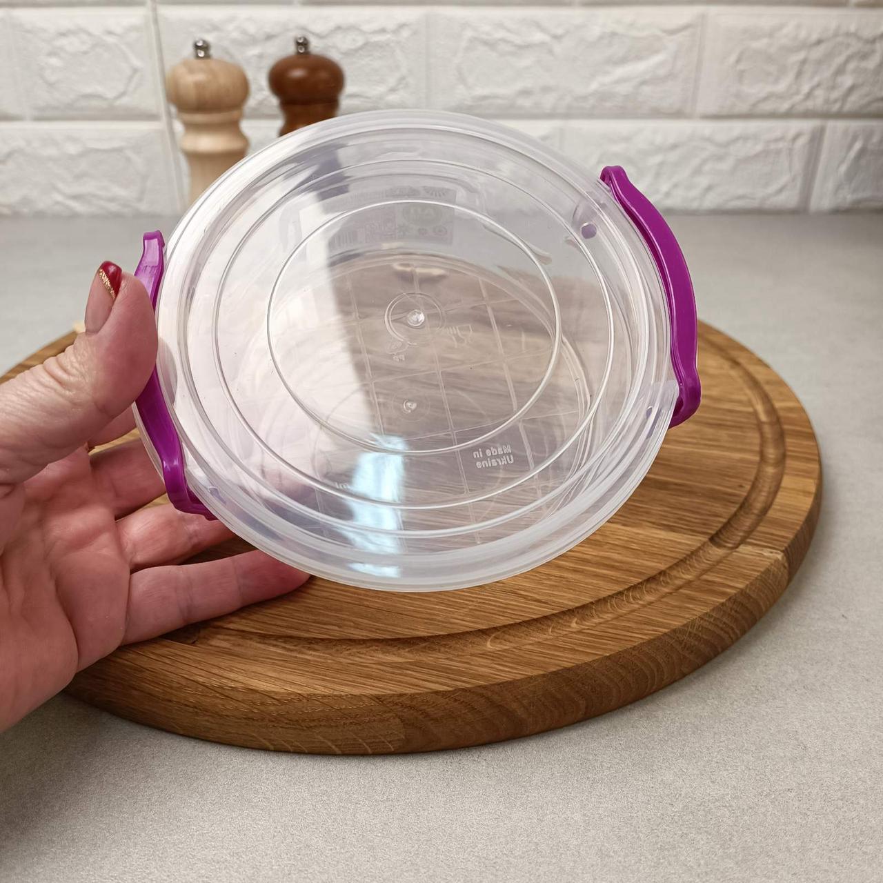 Круглий харчовий контейнер із ручками-засувками 0.6л