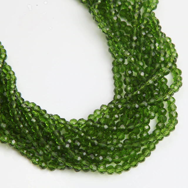 Бусини рондель скло 4х3мм приблизно 120 шт., колір — зелений прозорий