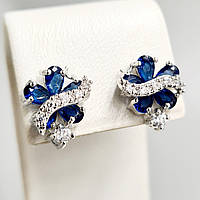 Сережки-гвоздики ХР. Родій. Камені: білий та синій циркон. Довжина: 13 мм. Ширина: 10 мм.