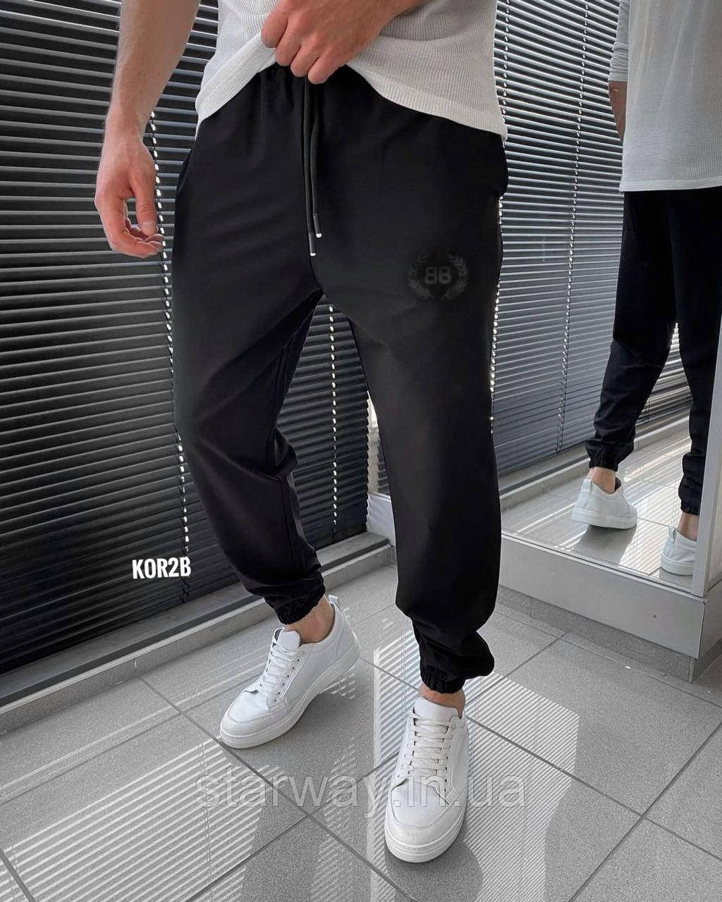 Трикотажні чорні штани з чорним принтом balenciaga