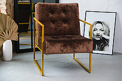 М'яке, велике крісло в оксамиті на золотому каркасі