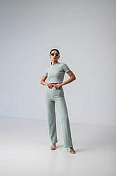 Костюм жіночий літній трикотаж рубчик м'ятного кольору топ та штани розмір 42-46