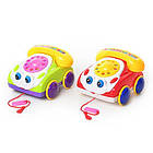 Дитяча іграшка-каталка 0316 машинка-телефон,звук, 2 кольори, що штовхають очима, показує мову, у ляльці, 18-17-11 см
