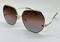 Женские солнцезащитные очки с градиентом в тонкой металлической оправе фигурные дужки