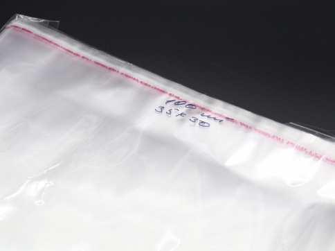 Пакувальні ПП пакетики з клейкою смугою 35х30см 25мкм 100шт/уп у закритому вигляді - 30х30см прозорі / Пакувальні ПП пакетики з, фото 1