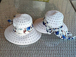 Солом'яний жіночий капелюх капур із середніми крисами прикрашений стрічкою