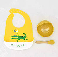 Посуда детская силиконовая для кормления Крокодил желтый ( Тарелка на присоске ,ложка и слюнявчик)