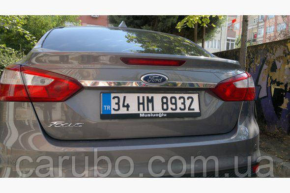 Ford Focus 2011 - Sedan Накладка над номером, фото 1
