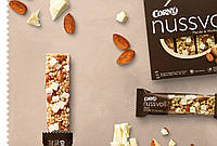 Батончик злаковый CORNY Nussvoll Mandel & Weisse Schok ореховый миндаль и белый шоколад 96 г, 12уп/ящ