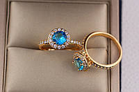 Кольцо Xuping Jewelry голубой камень с мелкими фианитами по кругу р 16 золотистое