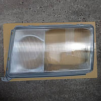 Скло фари лівої Mercedes 124 1990-1993 (світла рамка)