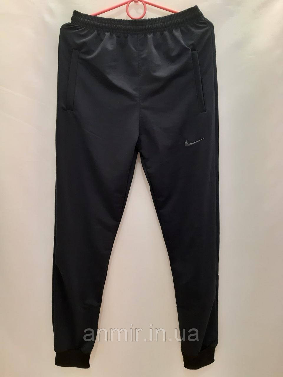 Спортивні штани чоловічі на манжетах трикотаж Nike норма 46-52, колір темно-синій