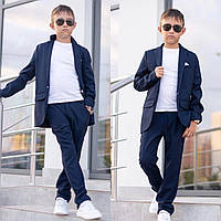Брючний костюм на хлопчика піджак + штани блакитного кольору розмір: від 116 до 152