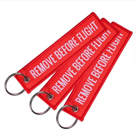 Брелок на ключі метал-ремієвики червона бирка Remove Before Flight прямокутна двостороння