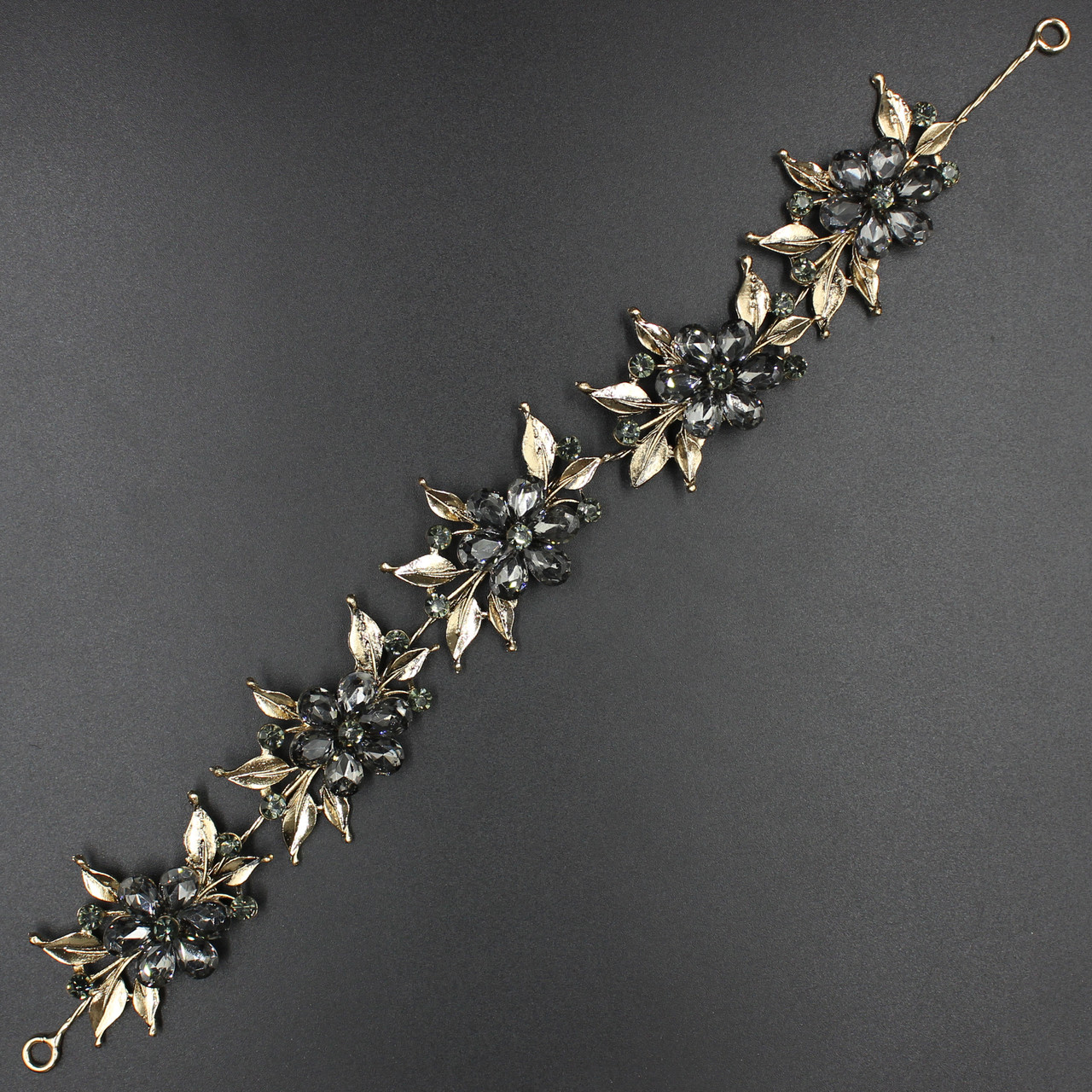 Гілка в зачіску для волосся золота з темно-сірими кристалами з квіточками 28 см з двома неведими