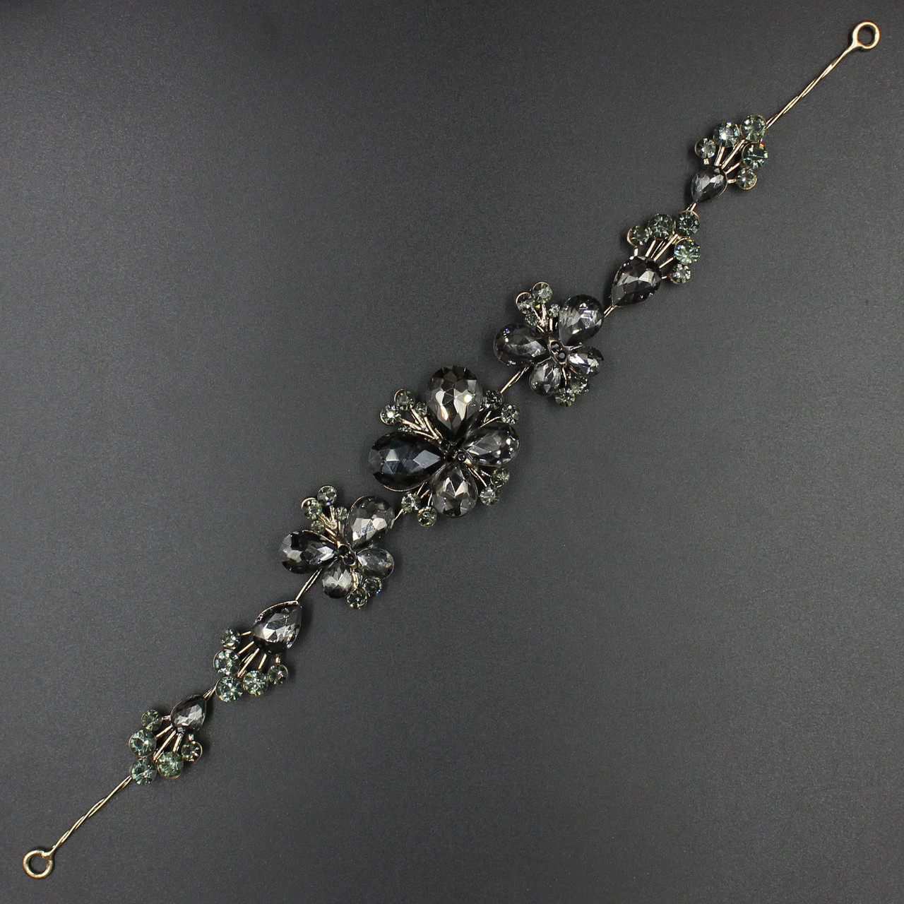 Гілка в зачіску для волосся металічна золотава з темно-сірими стразами метелика 28 см з двома неведими