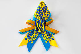 Брошка з орнаментом та гербом