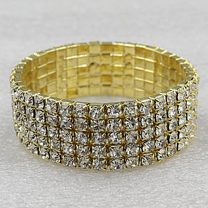 Браслет жіночий багаторядний на гумці м'який золотистого кольору кристалами ширина 20 мм 4 ряди каменів