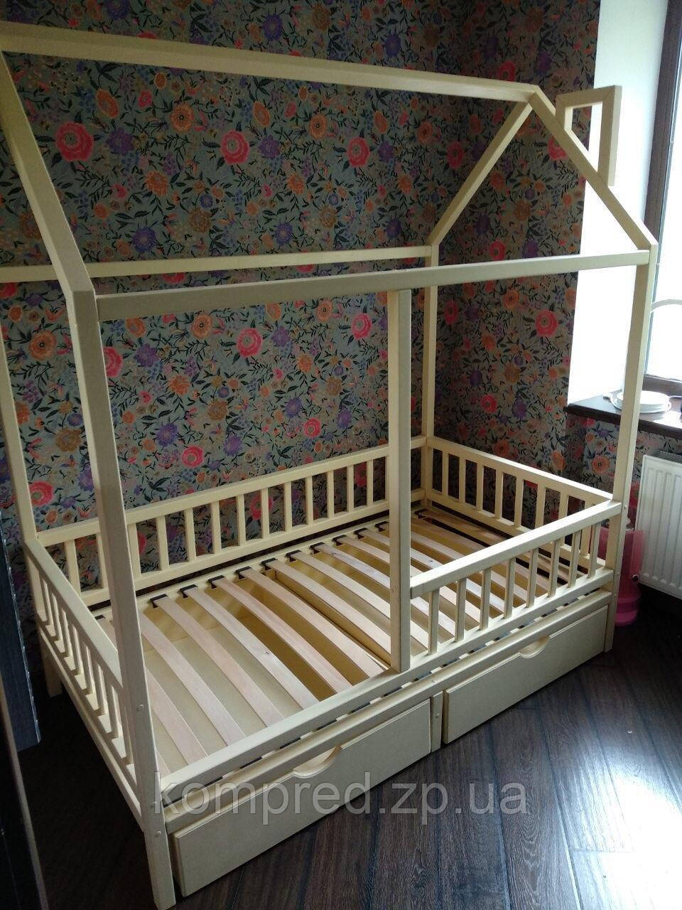 Дитяче дерев'яне ліжко з ящиками для білизни та бортиком