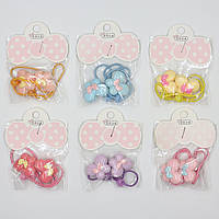 Набір гумок дитячих паковань 20 штук у стрічці кольорові метелики з намистинами різних кольорів і розмірів