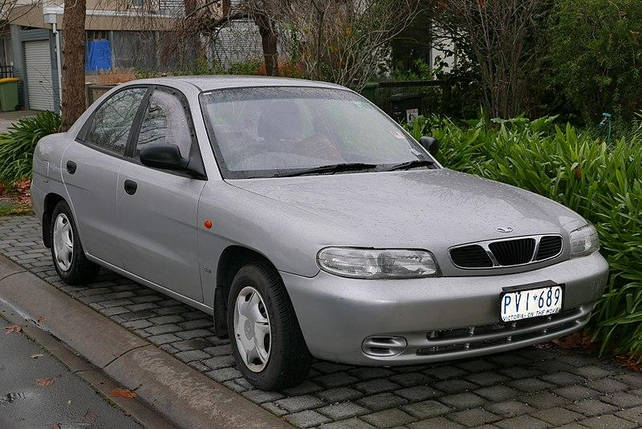 Радіатор охолодження Daewoo Nubira від 1997 р. двигунами 1.6 1.8 2.0, фото 4