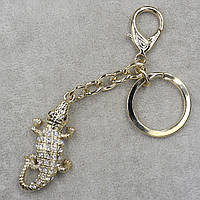 Брелок металевий золотистого кольору крокодила з білими стразами, що переливаються, з карабіном розмір 12 см