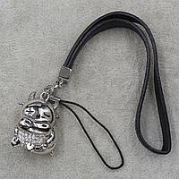 Брелок на чорній нитки з екошкіри металевого сріблястого кольору бичок із білими стразами розмір 15 см