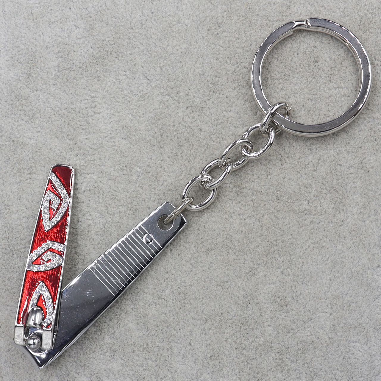 Брелок металевого сріблястого кольору кольорова емаль щипці для нігтів різних кольорів зі стразами розмір 13 см - фото 1 - id-p1665927397