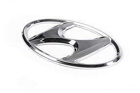 Емблема (самоклейка, 125 мм на 65 мм) Hyundai Accent 2006-2010 рр. AUC Значок Хюндай Акцент