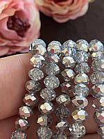 Бусини кришталеві (Рондель) 6х4м пачка - 85-95 шт, колір - прозорий сірий срібний бік
