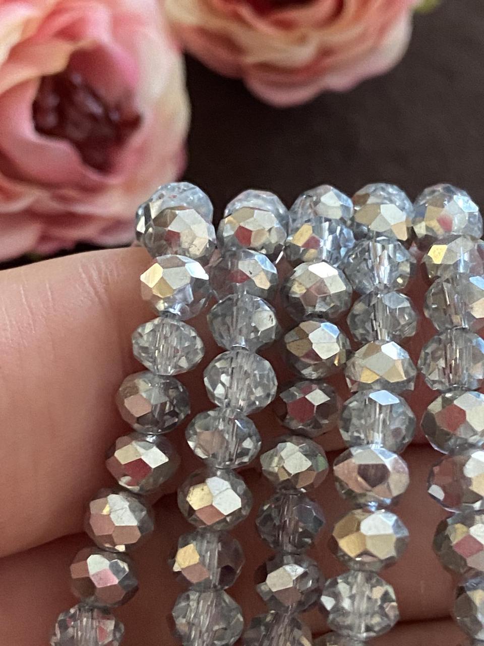 Бусини кришталеві (Рондель) 6х4м пачка - 85-95 шт, колір - прозорий сірий срібний бік