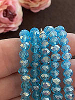 Бусини кришталеві (Рондель) 6х4 мм пачка — приблизно 85-95 шт., блакитний прозорий з АБ