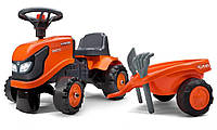 Детский трактор каталка Falk Baby Kubota 260C с прицепом, граблями и лопатой