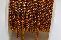 010SS6 Стразовая цепь honey amber в оправе под цвет страз плотная (2 мм).Цена за 10 см