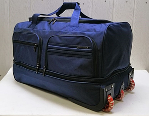 Дорожня сумка на колесах синій колір