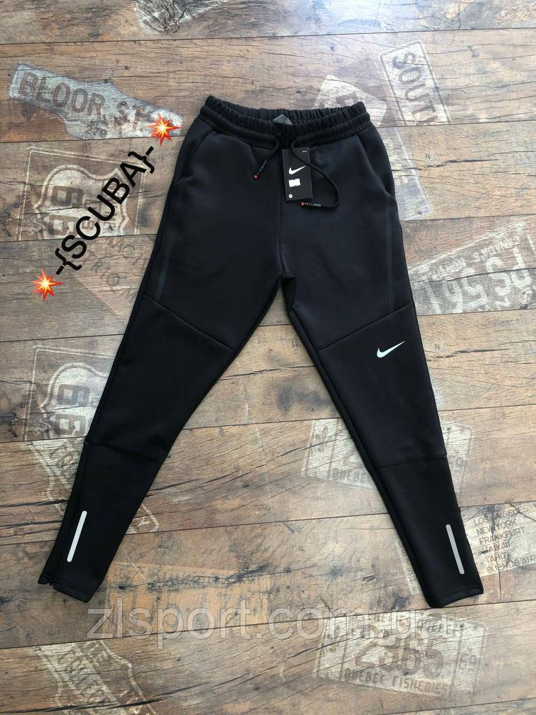 Завужені чоловічі спортивні штани Nike еластик