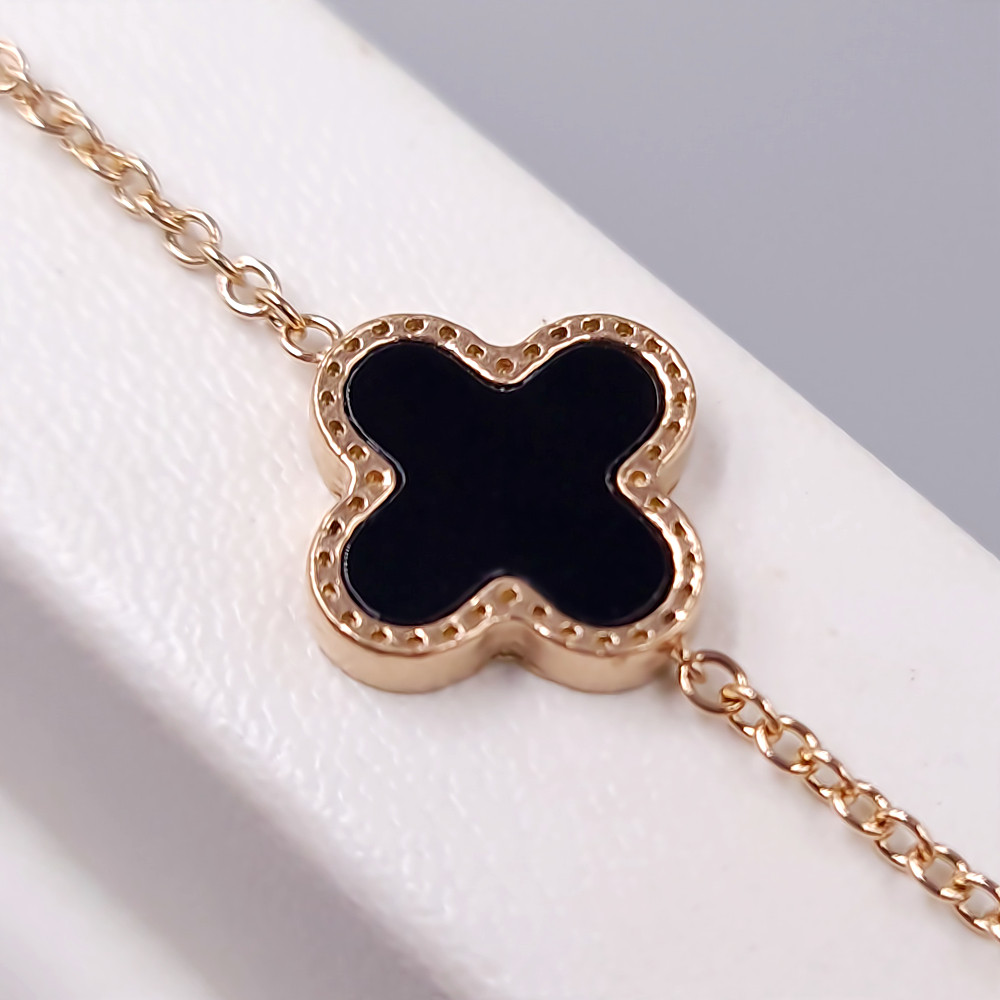 Двосторонній браслет Stainless Steel із чорно-білою емаллю. Сталь. Позолота ЧВ. Довжина: 17-20 см