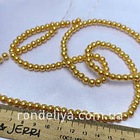 Нимистини жемчужні золотий діаметр 6 мм на нитці